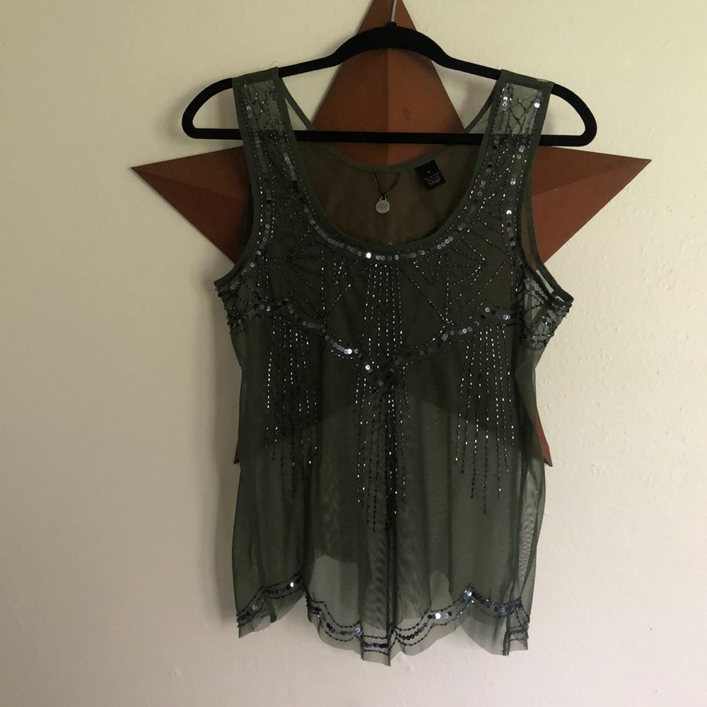 Sheer dark green tank with Embellishments.